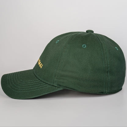 Green baseball cap with a brand logo on a light gray background