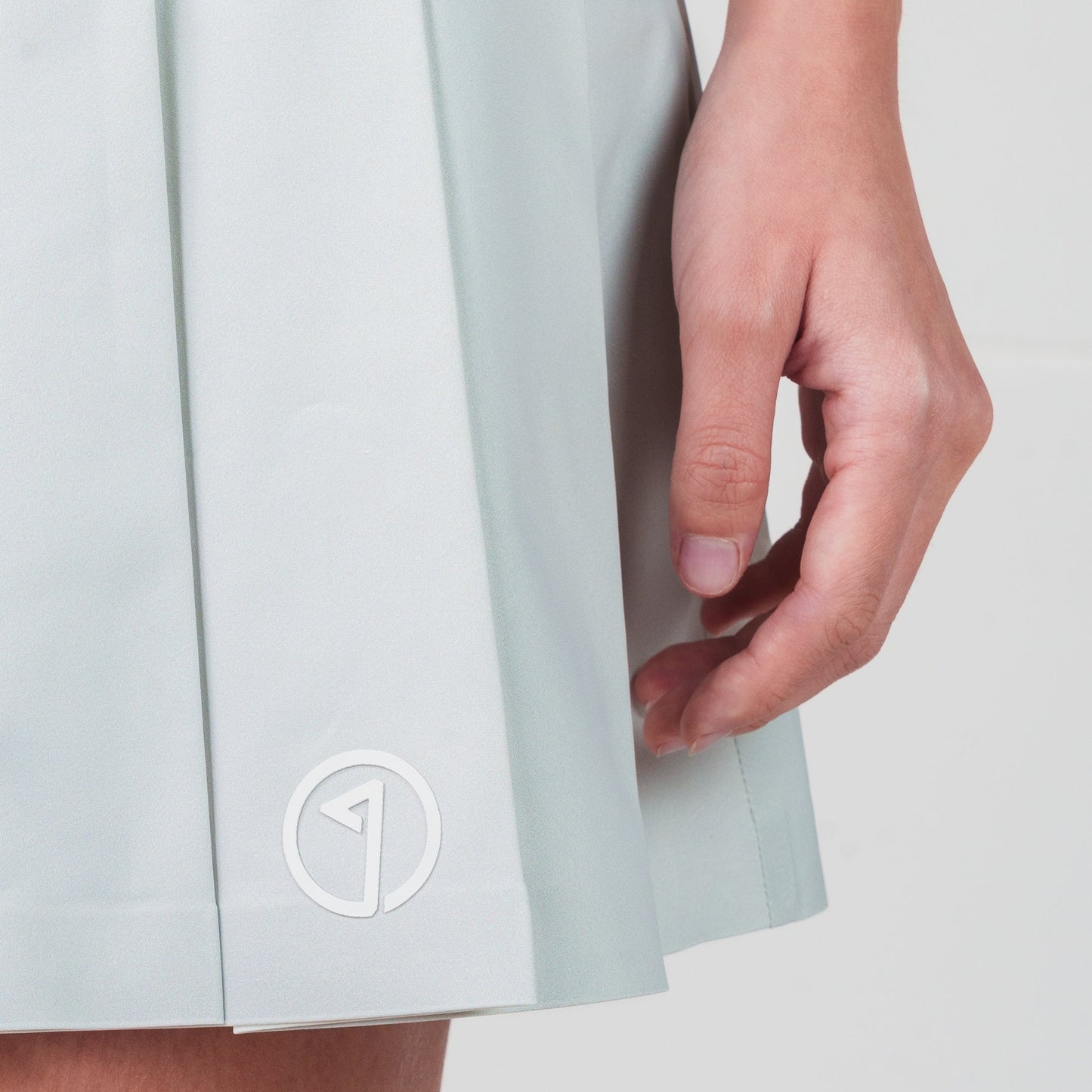 Light blue skirt with a logo on a white background