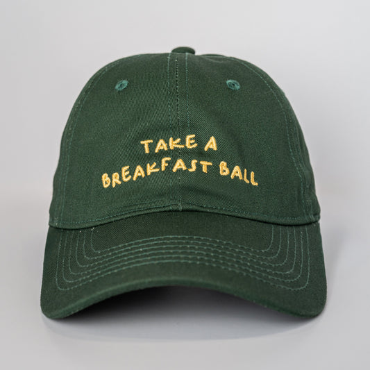 Green cap with 'Take a Breakfast Ball' text on a light gray background