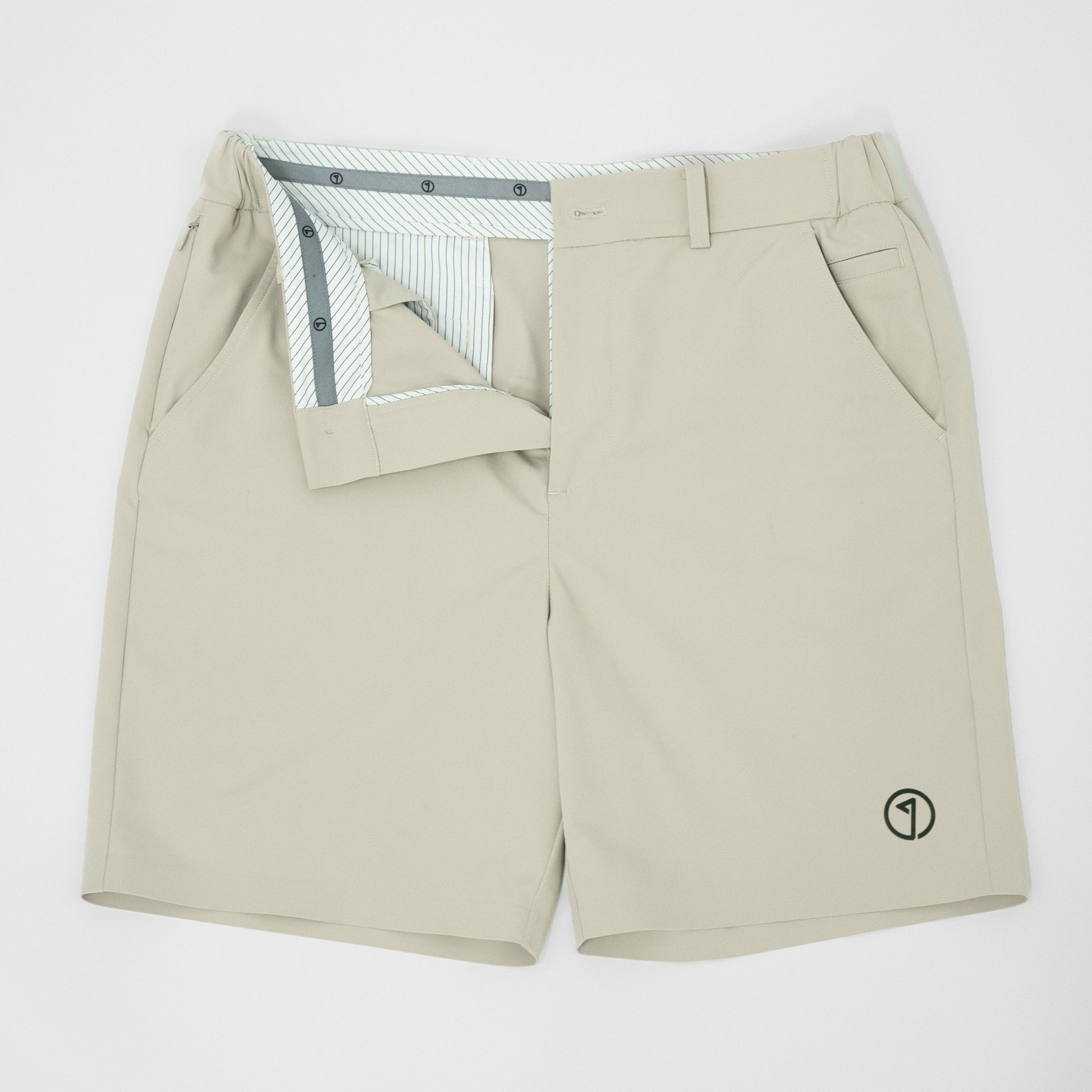 Beige shorts with a small logo on a white background
