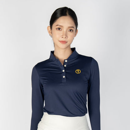 Woman wearing a navy long-sleeve top and white skirt on a white background